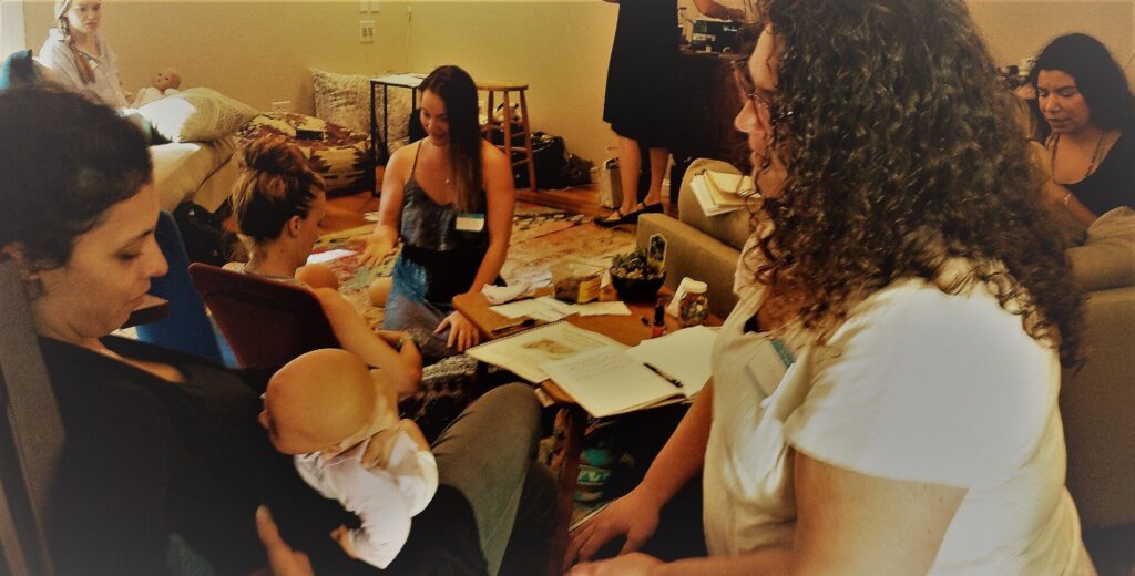 Woman Learning Breastfeeding Basics in Doula Training