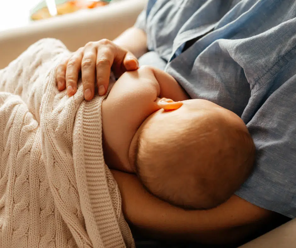 Woman Breastfeeding Baby